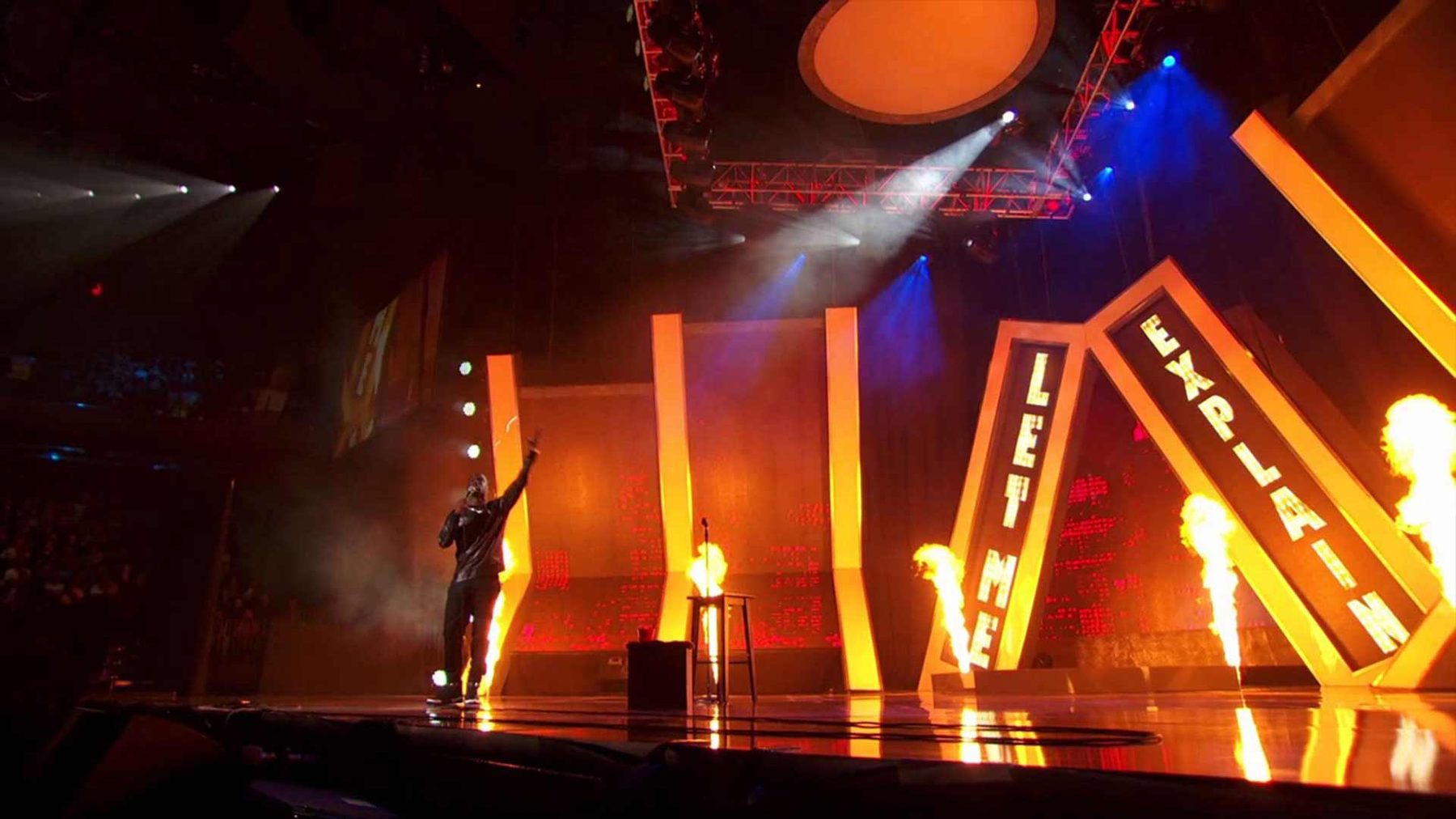 Kevin Hart on the Let Me Explain set with flame effects