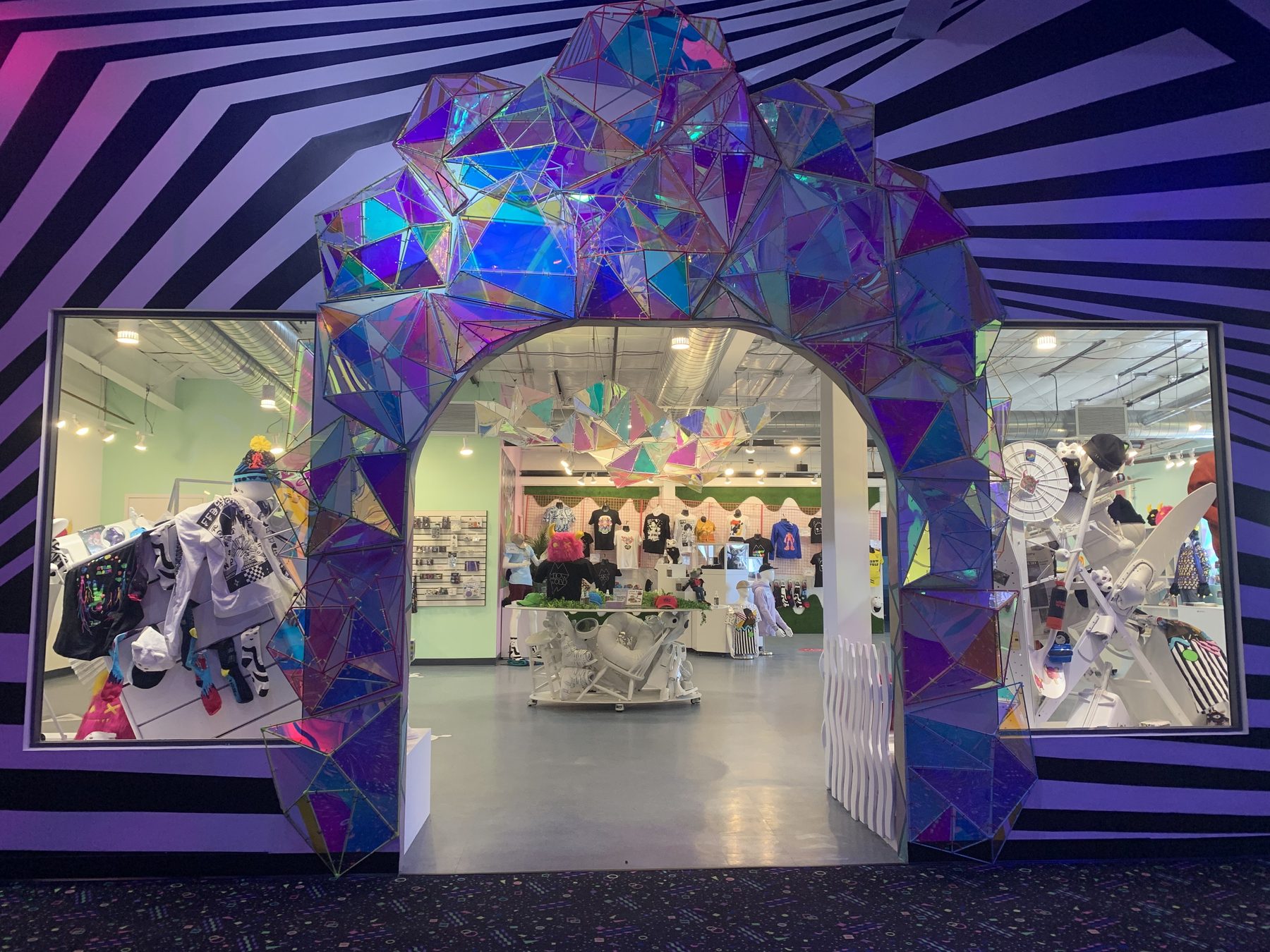 Iridescent crystal archway into the Meow Wolf shop